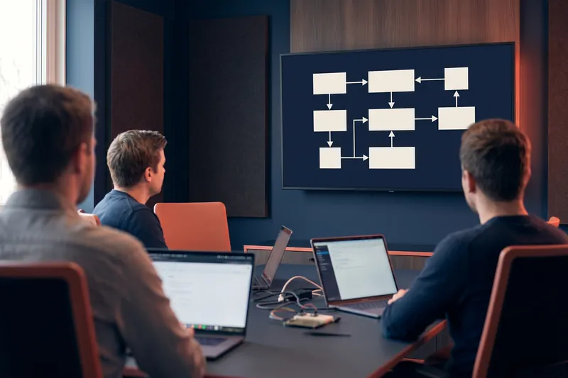Training session in front of an architecture diagram
